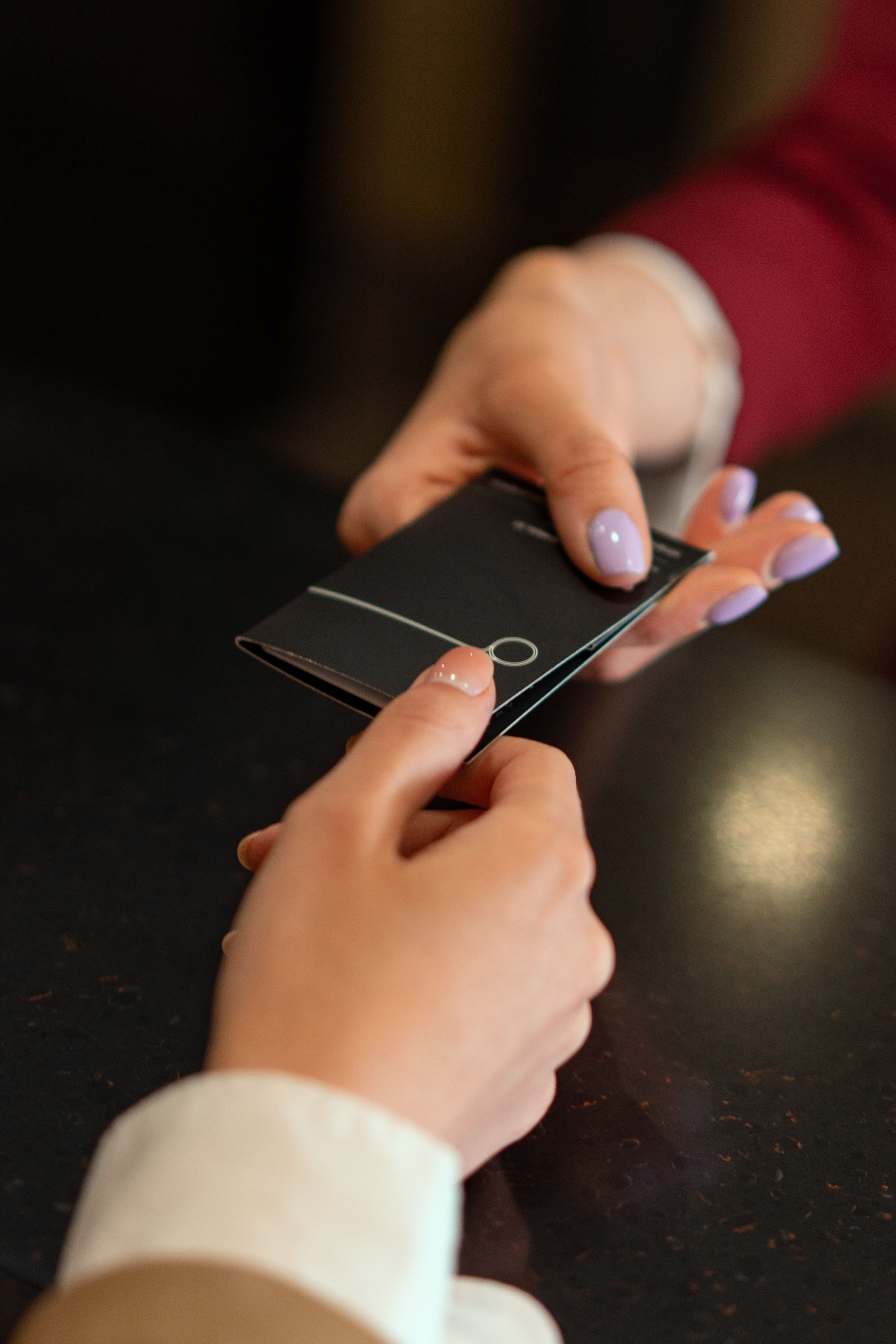 Guest handing over a keycard at check-in